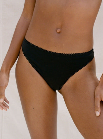 Kit Undergarments Organic Cotton Mid-Rise Thong in Onyx, 95% organic cotton, 5% spandex